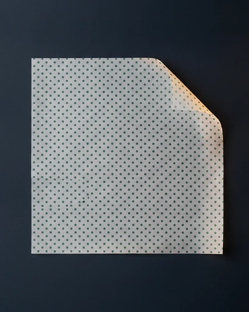 Custom deli / greaseproof paper, close-up of the edge, surface texture and finish