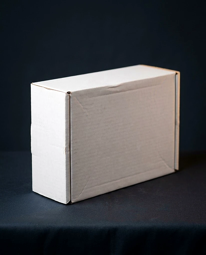 Custom white mailer box, closed, smooth white coated E-flute exterior